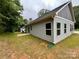 Exterior view of the home with vinyl siding and backyard at 212 Queens Ct, Gastonia, NC 28052