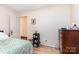 The bedroom has ample space, a neutral color scheme, and a convenient door to an adjacent room at 2210 Joes Lake Rd, Shelby, NC 28152