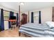 Bedroom with a four-poster bed, windows, and a TV on a desk at 2210 Joes Lake Rd, Shelby, NC 28152
