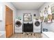 Functional laundry room with washer, dryer, storage, and natural light at 2210 Joes Lake Rd, Shelby, NC 28152
