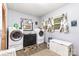 Convenient laundry room with a washer, dryer, and storage solutions at 2210 Joes Lake Rd, Shelby, NC 28152