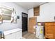 Utility room with a window, door, and equipment for home maintenance at 2210 Joes Lake Rd, Shelby, NC 28152