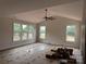 Bright room with large windows, a ceiling fan, and light-colored walls offers a spacious and inviting atmosphere at 2589 Polo Ln, Maiden, NC 28650