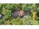 Aerial view of a stunning residence with beautiful landscaping and surrounded by mature trees at 2709 Blythe Rd, Waxhaw, NC 28173