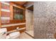 Shower room featuring tile and wooden accents with an open window view at 2709 Blythe Rd, Waxhaw, NC 28173