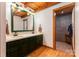 Bathroom with dual sinks, custom cabinetry and framed mirror, alongside a tiled shower at 2709 Blythe Rd, Waxhaw, NC 28173