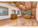 Cozy bedroom with light wood floors, wood ceiling, dresser, and a comfortable bed at 2709 Blythe Rd, Waxhaw, NC 28173