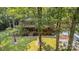 Beautiful home with an inviting covered porch surrounded by well-manicured lawn and mature trees at 2709 Blythe Rd, Waxhaw, NC 28173
