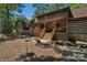 Charming log home with a covered front porch and professionally landscaped yard at 2709 Blythe Rd, Waxhaw, NC 28173