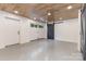 A spacious garage offers ample storage, accented by a stylish sliding barn door and wood plank ceiling at 2709 Blythe Rd, Waxhaw, NC 28173