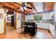 Rustic kitchen featuring wooden ceilings, an island with seating, and white cabinetry at 2709 Blythe Rd, Waxhaw, NC 28173