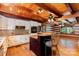 Charming kitchen with granite counters, wooden ceiling, stainless appliances, and island seating at 2709 Blythe Rd, Waxhaw, NC 28173