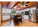 Modern kitchen with stainless steel appliances, island, and white cabinets at 2709 Blythe Rd, Waxhaw, NC 28173