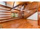 Spacious living room with wood walls, floors, and staircase at 2709 Blythe Rd, Waxhaw, NC 28173