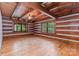 Bright, open living space featuring wood floors, beamed ceiling, and large windows at 2709 Blythe Rd, Waxhaw, NC 28173