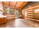 Bright living room with hardwood floors, wood walls, sink, and natural light at 2709 Blythe Rd, Waxhaw, NC 28173
