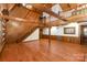 Open living room with exposed beams and hardwood floors at 2709 Blythe Rd, Waxhaw, NC 28173