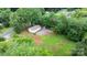 Aerial view of home with backyard, driveway, and mature trees at 2980 N Church St, Claremont, NC 28610