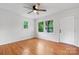 Bright bedroom with hardwood floors, ceiling fan and natural light from windows at 2980 N Church St, Claremont, NC 28610