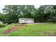 Exterior view of home shows backyard, siding, and landscaping at 2980 N Church St, Claremont, NC 28610