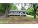 Charming one-story home featuring fresh landscaping and a welcoming entryway at 2980 N Church St, Claremont, NC 28610