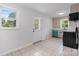 Bright eat-in kitchen with tile flooring, lots of natural light, and white cabinets at 2980 N Church St, Claremont, NC 28610