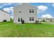 Backyard featuring a grassy lawn and patio, perfect for outdoor entertaining at 3073 Langhorne Sw Ave, Concord, NC 28027