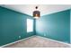 Bedroom featuring a unique light fixture and a window for natural light at 3073 Langhorne Sw Ave, Concord, NC 28027