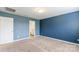 Spacious bedroom features plush carpeting, neutral walls, and an ensuite bathroom at 3073 Langhorne Sw Ave, Concord, NC 28027