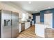 Modern kitchen with stainless steel appliances, granite countertops, and an island with breakfast bar seating at 3073 Langhorne Sw Ave, Concord, NC 28027