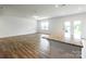 Bright living space featuring a granite countertop, seamlessly connected to the kitchen and backyard access at 3073 Langhorne Sw Ave, Concord, NC 28027