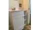 Bathroom vanity with white cabinets and a sink plus open shelves at 317 Heilig Ave, Salisbury, NC 28144