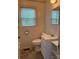 Bathroom featuring a modern sink, a toilet, and a window at 317 Heilig Ave, Salisbury, NC 28144