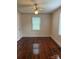 Bedroom with gleaming hardwood floors, ceiling fan and window at 317 Heilig Ave, Salisbury, NC 28144
