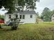 Brick home showcasing a well-maintained lawn and simple landscaping at 317 Heilig Ave, Salisbury, NC 28144