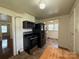 Functional kitchen showcasing black appliances and a view into a room with built-in shelving at 317 Heilig Ave, Salisbury, NC 28144