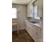 Classic kitchen with white cabinets, double basin sink, and window views at 317 Heilig Ave, Salisbury, NC 28144