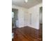 Open living room with hardwood floors and a view into the bathroom at 317 Heilig Ave, Salisbury, NC 28144