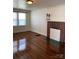Living room featuring a fireplace, hardwood flooring, and large windows at 317 Heilig Ave, Salisbury, NC 28144