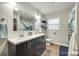 Bathroom featuring double sinks, neutral paint, a window and vinyl floors at 3447 Filbert Hwy, Clover, SC 29710