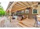 Spacious wooden deck with covered pergola, ceiling fan and hot tub, perfect for outdoor entertaining at 3447 Filbert Hwy, Clover, SC 29710