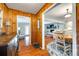 Warm entryway featuring hardwood floors, wood paneling, and a seamless transition to the open-concept living spaces at 3447 Filbert Hwy, Clover, SC 29710