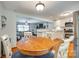 Open kitchen with white cabinets, modern appliances, and seamless flow to living area at 3447 Filbert Hwy, Clover, SC 29710