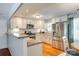 Modern kitchen with white cabinets, stainless steel appliances, and ample counter space for meal preparation at 3447 Filbert Hwy, Clover, SC 29710