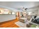 Open-concept living room with hardwood floors and a view into the kitchen, creating an ideal space for entertaining at 3447 Filbert Hwy, Clover, SC 29710