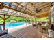 Inviting outdoor patio featuring a ceiling fan, lounge seating and a view of the sparkling fenced in pool at 3447 Filbert Hwy, Clover, SC 29710
