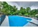 Fenced in in-ground pool with diving board surrounded by lush greenery at 3447 Filbert Hwy, Clover, SC 29710