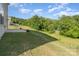 Expansive backyard featuring lush greenery, a concrete patio, and plenty of space at 347 Carolina Hemlock Dr, Locust, NC 28097