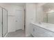 Well-lit bathroom featuring double vanity, shower, and tile flooring at 347 Carolina Hemlock Dr, Locust, NC 28097