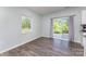 Cozy kitchen nook with a window and sliding glass doors to the back yard at 347 Carolina Hemlock Dr, Locust, NC 28097